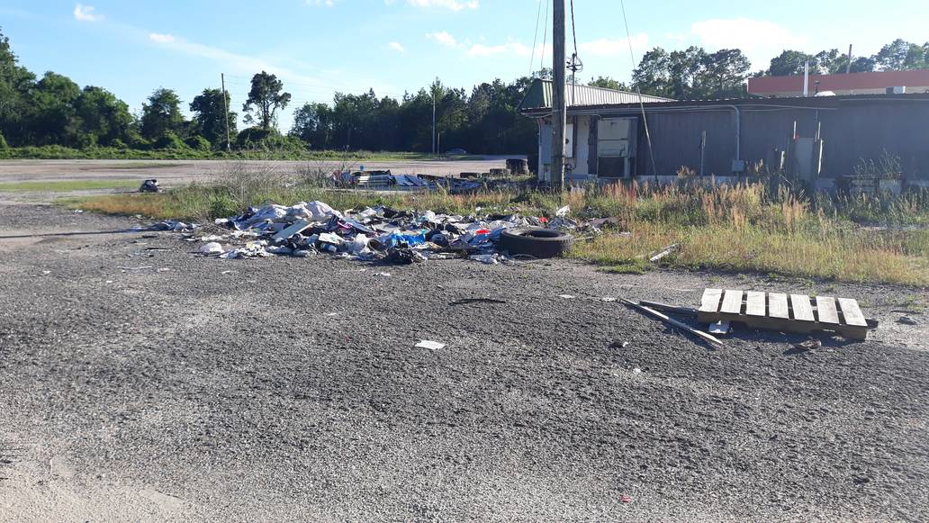 Debris Outside Of Storefront Junk Removal Service Something Old Salvage 6505 North W Street Pensacola FL 32505 850 758 9900 www.somethingoldsalvage.com1