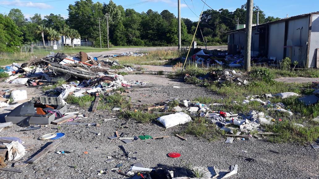 Debris Outside Of Storefront Junk Removal Service Something Old Salvage 6505 North W Street Pensacola FL 32505 850 758 9900 www.somethingoldsalvage.com