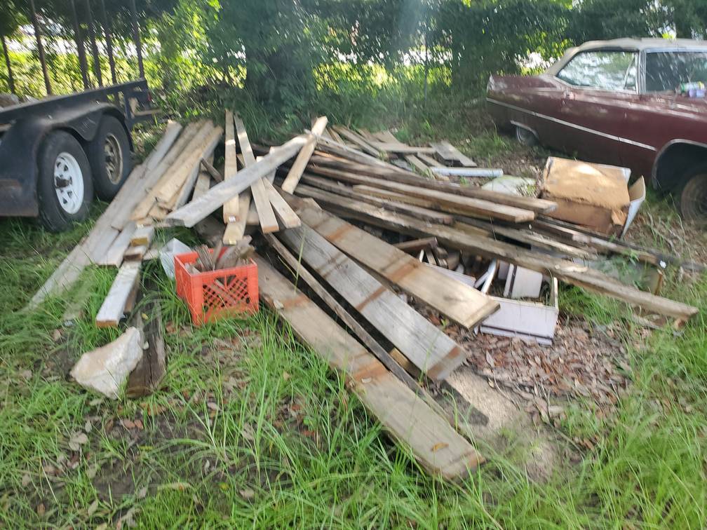 Pile Of Wood Outside Junk Removal Service Something Old Salvage 6505 North W Street Pensacola FL 32505 850 758 9900 www.somethingoldsalvage.com